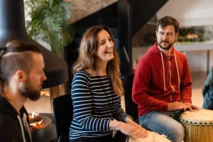 teambuilding-employee-smiling-enjoying-drumming