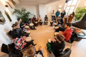 teambuilding-drum-circle-overhead-shot-teacher-explains